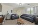 Bonus room with two seating areas and mini fridge at 3064 E Michelle Way, Gilbert, AZ 85234