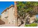 Attractive home featuring a neutral stucco exterior, arched entry, and convenient two-car garage at 3064 E Michelle Way, Gilbert, AZ 85234