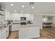Bright kitchen features an island, modern appliances, and neutral countertops and white cabinets at 3064 E Michelle Way, Gilbert, AZ 85234
