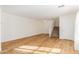 Bright living room showcasing hardwood floors, a staircase, and fresh, neutral paint throughout the space at 3064 E Michelle Way, Gilbert, AZ 85234
