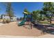 Community playground with slide, climbing structures, and safety ground cover at 3064 E Michelle Way, Gilbert, AZ 85234
