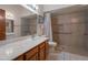 Accessible bathroom featuring a walk-in shower with grab bars and a spacious vanity at 3227 W Kristal Way, Phoenix, AZ 85027