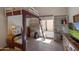 Unique bedroom with a raised bed, built-in storage, and tiled floors at 3227 W Kristal Way, Phoenix, AZ 85027