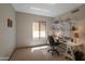 Bright room with desk, chair, and built-in shelving with a window view at 3227 W Kristal Way, Phoenix, AZ 85027