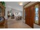 Inviting entryway leading to an open dining area, highlighted by a decorative front door with stained glass accents at 3227 W Kristal Way, Phoenix, AZ 85027