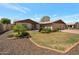 Charming single-story home with a well-maintained lawn and mature landscaping at 3227 W Kristal Way, Phoenix, AZ 85027