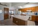 Spacious kitchen with a functional island, ample cabinet space, and a view into the adjacent dining area at 3227 W Kristal Way, Phoenix, AZ 85027