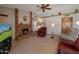 Inviting living room with a brick fireplace and tile flooring providing a warm and cozy ambiance at 3227 W Kristal Way, Phoenix, AZ 85027
