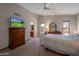 Spacious main bedroom featuring a ceiling fan, large dresser, and ensuite bathroom access at 3227 W Kristal Way, Phoenix, AZ 85027