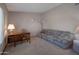 Versatile home office space featuring a comfortable couch and a functional desk area, perfect for work or relaxation at 3227 W Kristal Way, Phoenix, AZ 85027