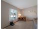 Functional office space with natural light, featuring a cozy couch and desk area, ideal for a productive work environment at 3227 W Kristal Way, Phoenix, AZ 85027