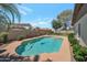 Backyard pool with a lush green lawn, palm tree, and block fence at 3227 W Kristal Way, Phoenix, AZ 85027