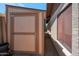 Exterior view of a painted storage shed with access door and visible latch hardware in the side yard at 3227 W Kristal Way, Phoenix, AZ 85027