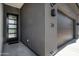 Modern exterior features a sleek front door and a black garage door at 377 E Windsor Ave # 24, Phoenix, AZ 85004