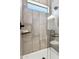 Contemporary walk-in shower featuring gray tiling, a black fixture, and a glass enclosure at 377 E Windsor Ave # 24, Phoenix, AZ 85004