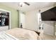 Bedroom features a view to the en-suite bathroom, closet space and a ceiling fan at 3842 W Ocotillo Rd, Phoenix, AZ 85019