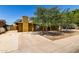 Charming single-story home with mature trees providing shade in the front yard and long driveway at 3842 W Ocotillo Rd, Phoenix, AZ 85019