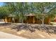 Charming single-story home with mature trees providing shade in the front yard at 3842 W Ocotillo Rd, Phoenix, AZ 85019