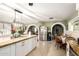 Open concept kitchen features granite counters, stainless steel appliances, tile floors, and natural light at 3842 W Ocotillo Rd, Phoenix, AZ 85019