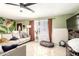 Inviting living room featuring a comfortable sectional sofa, tile floors, and ample natural light at 3842 W Ocotillo Rd, Phoenix, AZ 85019