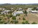 Aerial view of the home and community with desert landscaping and views of the mountains at 38709 N 16Th Pl, Phoenix, AZ 85086