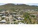 An aerial view of the home and community, surrounded by picturesque desert landscape at 38709 N 16Th Pl, Phoenix, AZ 85086