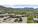 Aerial view of the home and neighborhood surrounded by mountains and desert landscaping at 38709 N 16Th Pl, Phoenix, AZ 85086