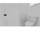 Bright, white bathroom featuring toilet and window at 38709 N 16Th Pl, Phoenix, AZ 85086