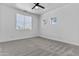 Bright bedroom with two windows and carpet flooring at 38709 N 16Th Pl, Phoenix, AZ 85086