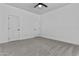 Large bedroom featuring two doors and carpet at 38709 N 16Th Pl, Phoenix, AZ 85086
