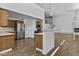 Open kitchen with stainless steel appliances, hardwood floors, and granite countertops at 38709 N 16Th Pl, Phoenix, AZ 85086