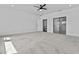 Large main bedroom with plush carpet, ceiling fan, and an ensuite bathroom at 38709 N 16Th Pl, Phoenix, AZ 85086
