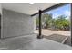 View of a covered outdoor patio with concrete and a view of the desert landscaping at 38709 N 16Th Pl, Phoenix, AZ 85086