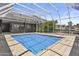 Backyard swimming pool with pool enclosure at 38709 N 16Th Pl, Phoenix, AZ 85086