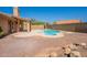 A refreshing pool, covered patio, and thoughtfully designed desert landscape create a perfect outdoor retreat at 4037 E Milton Dr, Cave Creek, AZ 85331