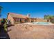 Enjoy the backyard with a private pool, covered patio, and serene desert landscaping at 4037 E Milton Dr, Cave Creek, AZ 85331