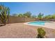 The backyard features a refreshing pool and low-maintenance desert landscaping at 4037 E Milton Dr, Cave Creek, AZ 85331