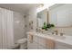 Bathroom featuring a double sink vanity with gold fixtures and a shower at 4037 E Milton Dr, Cave Creek, AZ 85331