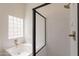 Clean bathroom features a shower-tub combo and a window providing natural light at 4037 E Milton Dr, Cave Creek, AZ 85331