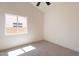 Bright bedroom featuring neutral carpet, window and fresh white paint at 4037 E Milton Dr, Cave Creek, AZ 85331
