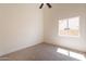 Comfortable bedroom with carpet, a ceiling fan, and natural light from the window at 4037 E Milton Dr, Cave Creek, AZ 85331