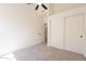 Comfortable bedroom with neutral carpet, closet, ceiling fan, and lots of natural light at 4037 E Milton Dr, Cave Creek, AZ 85331