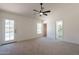 Bright bedroom features neutral carpet, a ceiling fan, and easy access to the pool at 4037 E Milton Dr, Cave Creek, AZ 85331