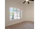 Bedroom featuring neutral carpet, window and fresh white paint at 4037 E Milton Dr, Cave Creek, AZ 85331