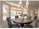 Lovely breakfast nook with a round table, stylish chairs, and views of the pool at 4037 E Milton Dr, Cave Creek, AZ 85331