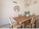 Open dining room area with wooden table and six chairs, with modern decor at 4037 E Milton Dr, Cave Creek, AZ 85331