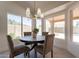 Cozy breakfast nook with a round table, stylish chairs, and plenty of natural light at 4037 E Milton Dr, Cave Creek, AZ 85331
