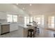 Modern kitchen with island seating, stainless steel appliances, open layout and bright natural light at 4037 E Milton Dr, Cave Creek, AZ 85331