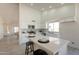 Bright kitchen with white cabinets, marble backsplash, an island and stainless steel appliances at 4037 E Milton Dr, Cave Creek, AZ 85331