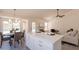 Open-concept kitchen with island, dining area and living room offering a seamless flow for entertaining at 4037 E Milton Dr, Cave Creek, AZ 85331